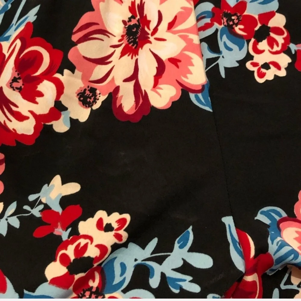 Band of Gypsies shorts romper black background with floral pattern